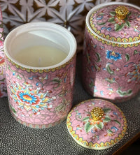 Handcrafted ceramic candle jar with ornate floral details and gold accents, scented with Mandarin and Matcha.