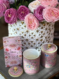 Handcrafted ceramic candle jar with ornate floral details and gold accents, scented with Mandarin and Matcha.