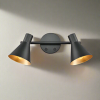 Matt black double wall light with gold inner.  Simple black metal rose with two black metal shades on a bar, directional lighting at it's industrial best. Great kitchen wall lighting, or perfect in a study or dining room.
H: 15 cm W:  30 cm