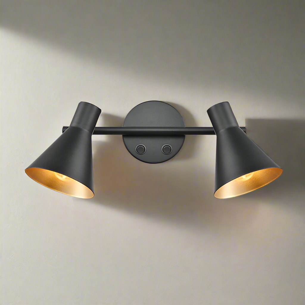 Matt black double wall light with gold inner.  Simple black metal rose with two black metal shades on a bar, directional lighting at it's industrial best. Great kitchen wall lighting, or perfect in a study or dining room.
H: 15 cm W:  30 cm