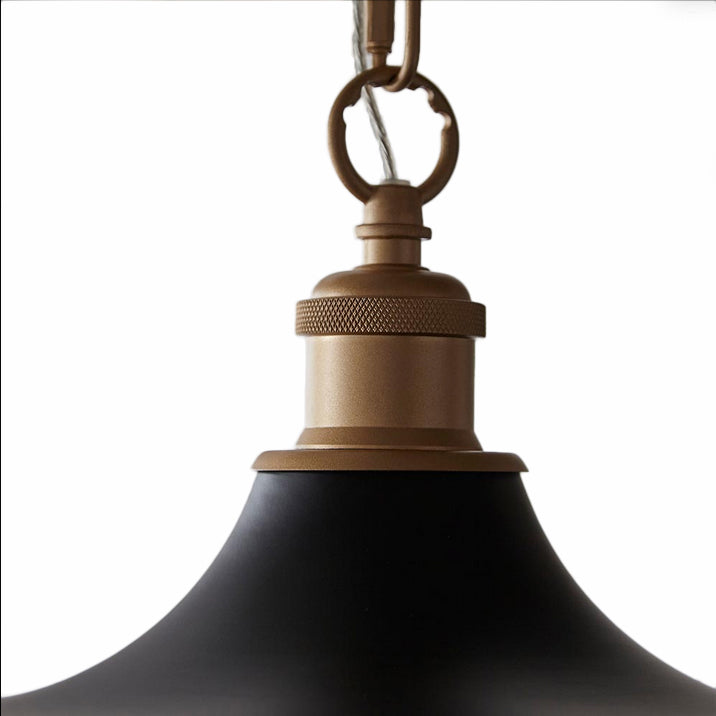 Modern pendant featuring a matt black finish in a chain. This wide disc pendant light is a striking, contemporary lighting fixture that combines sleek design with industrial charm. Its wide shape and the inner gold allows the soft light to spread evenly across any room. It is a very stylist and ideal for living rooms, bedrooms and kitchens