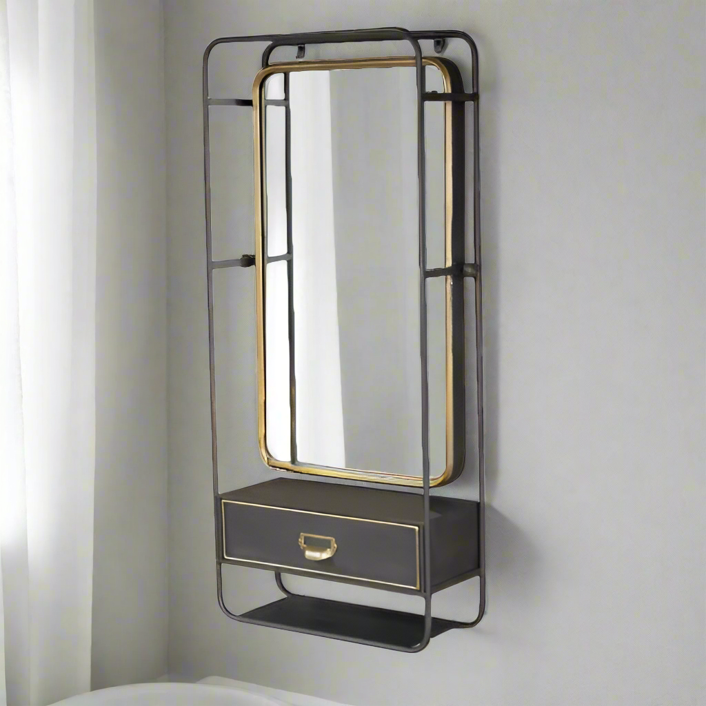 Metal swivel mirror set in dark metal casing with drawer, accented in brushed brass colour. Useful wall mounted mirror with the addition of a small drawer, perfect for your hall or bedroom. 