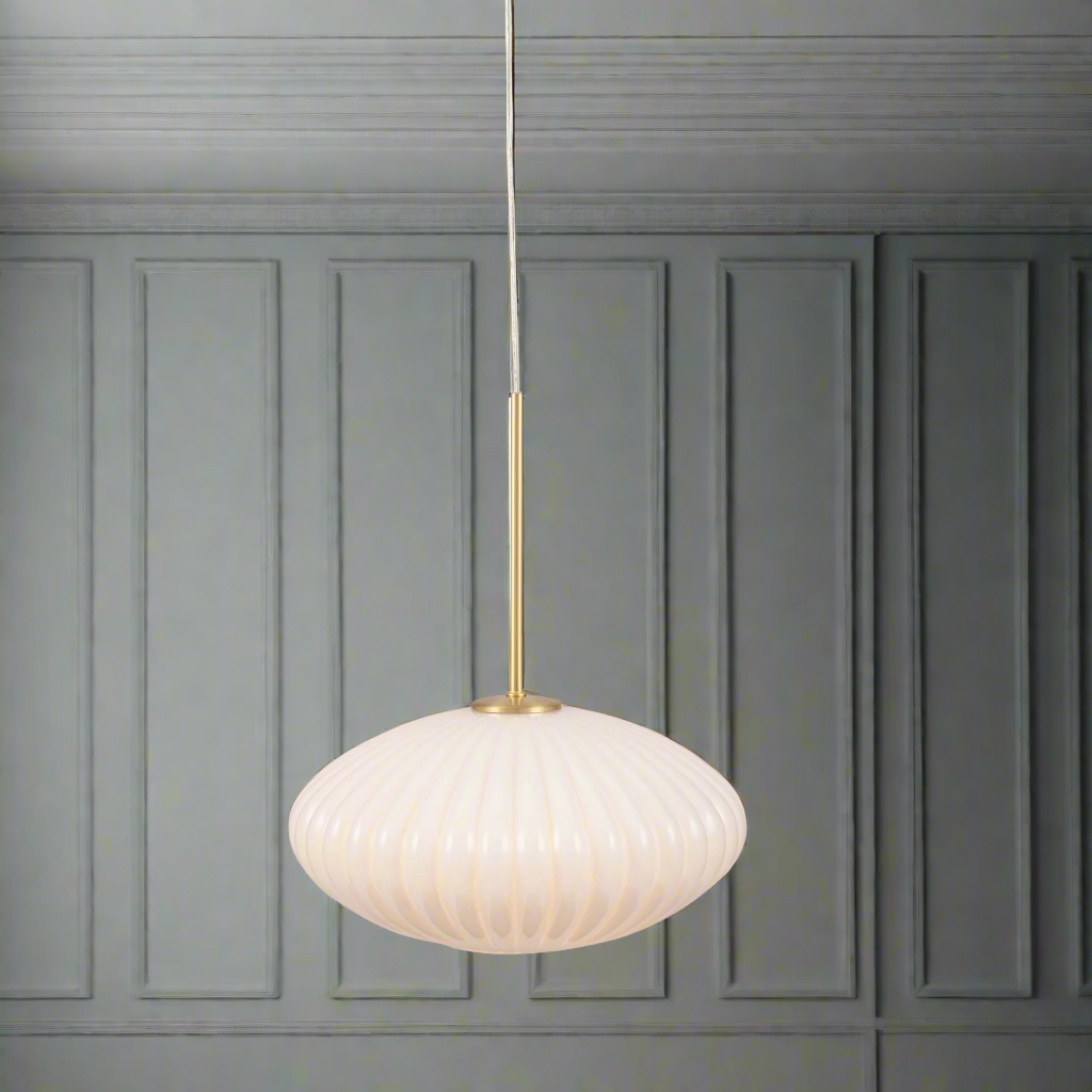 Milky white glass ribbed pendant.   An opaque glass pumpkin shaped pendant, perfect for a kitchen, or an island.  Great cloakroom light, lit with a warm led bulb to give the perfect muted glow to any room.