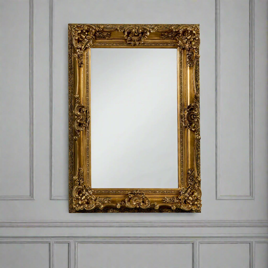 Ornate, burnt gold mirror, great overmantle size, can be placed vertically or horizontally. Classic carved frame to add a touch of opulence to any wall.