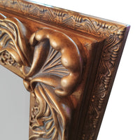 Ornate, burnt gold mirror, great overmantle size, can be placed vertically or horizontally. Classic carved frame to add a touch of opulence to any wall.