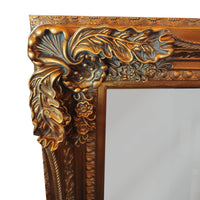 Ornate, burnt gold mirror, great overmantle size, can be placed vertically or horizontally. Classic carved frame to add a touch of opulence to any wall.