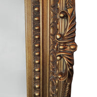 Ornate, burnt gold mirror, great overmantle size, can be placed vertically or horizontally. Classic carved frame to add a touch of opulence to any wall.