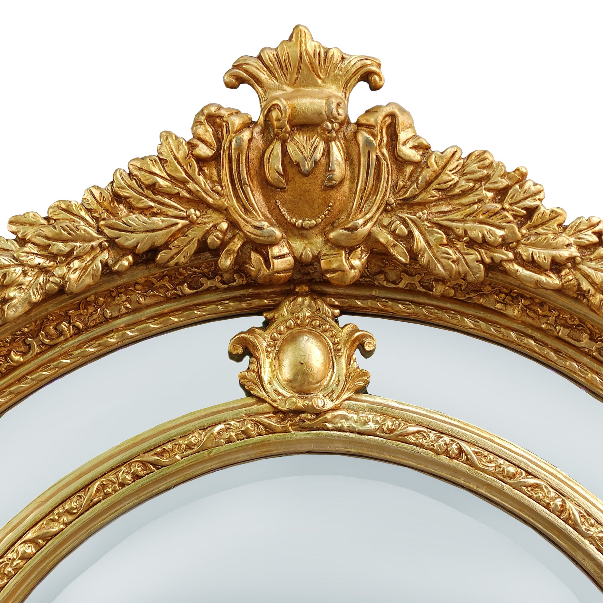 Extremely ornate arched gold mirror with beveled panels.  This statement mirror would look amazing in a hallway, just opening up the space and adding a luxurious air to your entryway. In a living room to flash out light and give the illusion of extra space.  Stunning rococo revival style with swags and medallions to the crown and heavily ornamented frame. The gilding is a beautifully opulent gilt leaf giving the frame an opulent lustre.  
There is no room in the house that would not ben