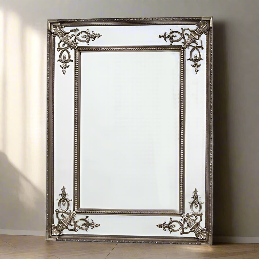 Silver gilt coloured, bevelled glass panels and ornate corners give this beautiful mirror a really luxurious feel.  