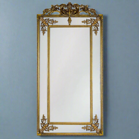 Stunning panelled gold mirror with decorative crown. The bevelled edges on the panels in this magnificent mirror spreads light in any room.   This is the slimmer version or our massive French mirror, tall, elegant and perfect in your bedroom or at the end of a corridor to add a light and space.