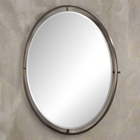 The mirror is framed by a slender, dark antique brushed brass frame. A substantial oval mirror with substantial metal frame, a luxurious look in any room of your house.