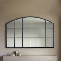 Low, wide window mirror, perfect overmantle size, adding space and perspective to any room. Arched metal framed window mirror placed over a fireplace or mantle.