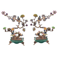 Bronze sculptured branches in this candelabra hold little porcelain birds and flowers and on the branches there are three bronze candleholders.  A mixture of greens, pinks, yellow and blue, the colourful tree is set on a rectangular green porcelain base on small bronze feet. The most decorative candleholder would look stunning as a centrepiece or set on a beautiful piece of furniture to add interest and a luxurious touch to your interior.