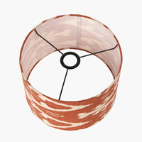 A beautiful red cotton ikat patterned shade. It can be used as a ceiling pendant shade or in a table lamp.