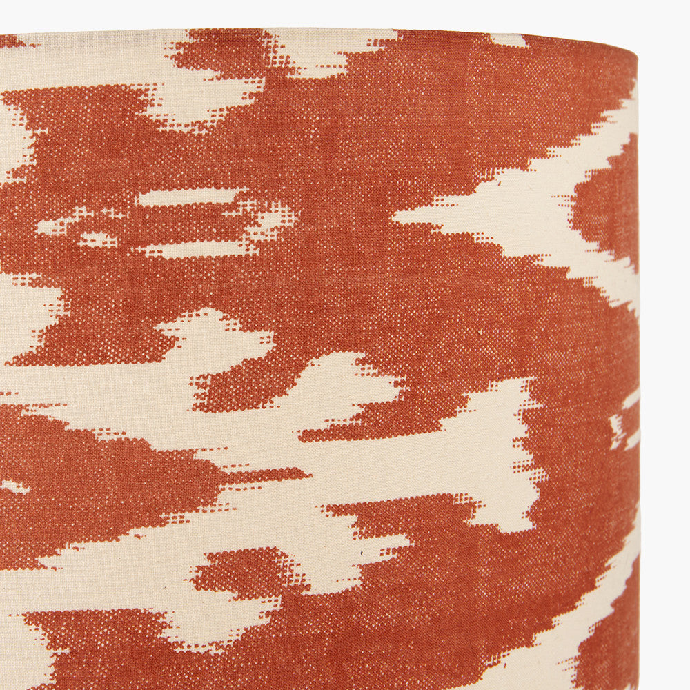 A beautiful red cotton ikat patterned shade. It can be used as a ceiling pendant shade or in a table lamp.