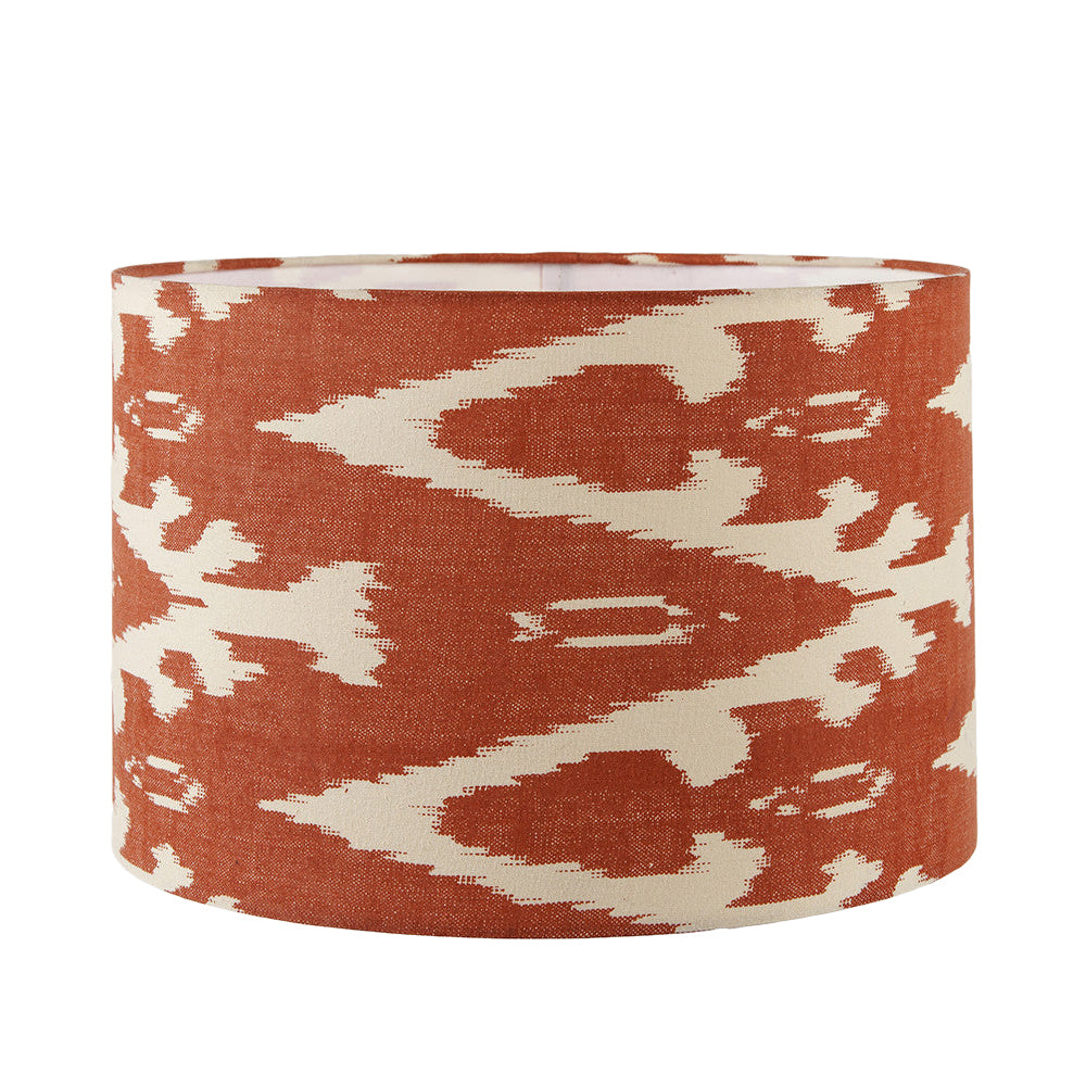 A beautiful red cotton ikat patterned shade. It can be used as a ceiling pendant shade or in a table lamp.