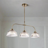 Three ribbed glass pendants on a fixed antique brass frame, perfect traditional light for a period house, over a kitchen island, dining table or even a billiard table. Linear lighting is a great way to light the darkest of rooms, the light spreading from the three shades, and this particular linear light is glamorous enough for any room in your home.