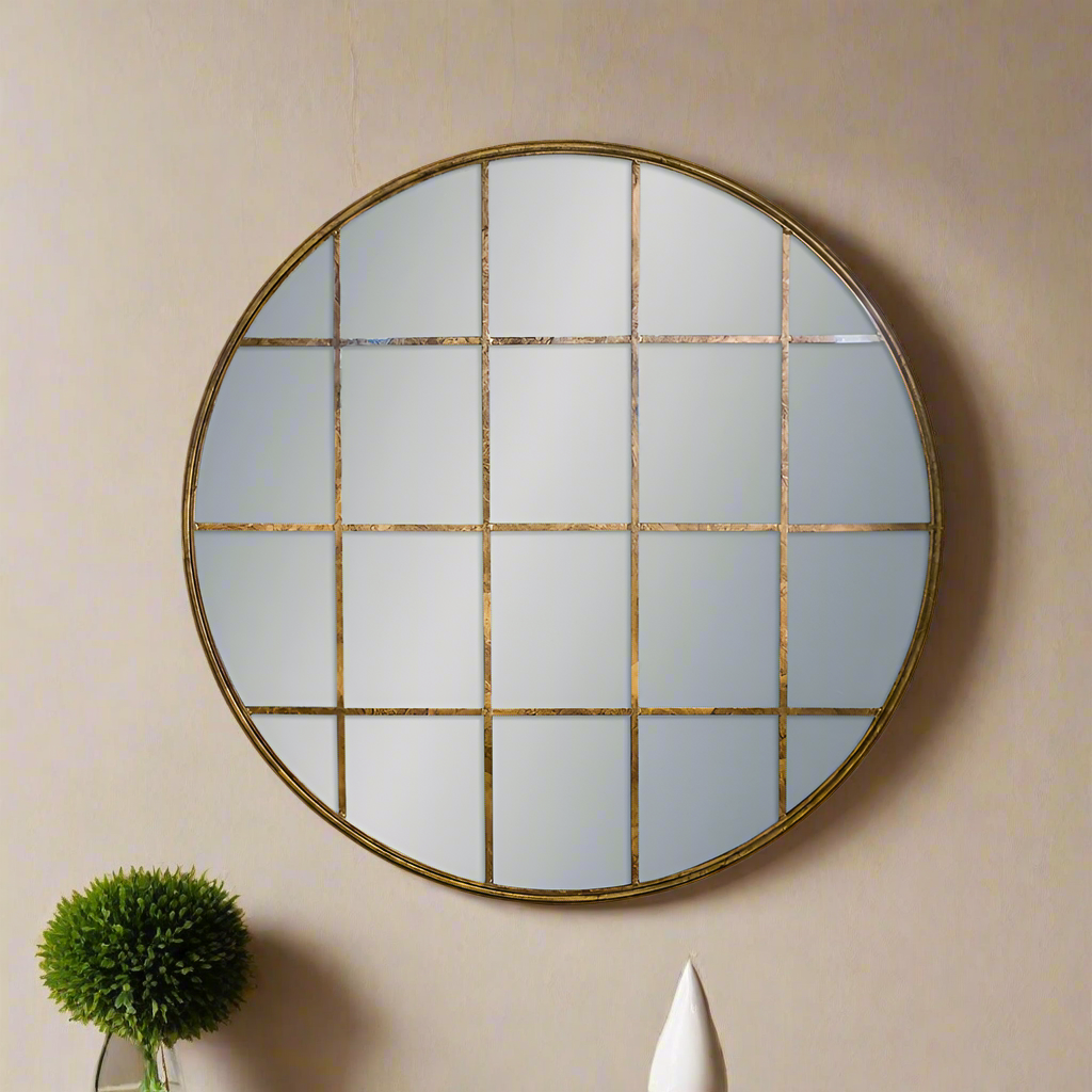 A circular distressed gold window mirror, for indoor or outdoor use.  The colour of this mirror is faded and would work well in a conservatory or on a patio, the glass would make the space appear larger.