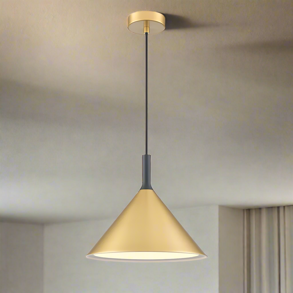 A contemporary satin brass pendant light with black fixtures and a brass cord, hanging from the ceiling.