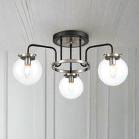 3 Glass globe semi- flush industrial style light, set in nickel metal frame. This semi-flush pendant it in a black and nickle finish so would look just as stunning in a contemporary home.
