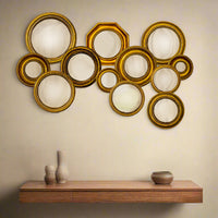 Mini convex gold framed mirrors which come in an assortment of sizes. This is a fantastic price and range which takes the headache out of creating your own wall assortment.