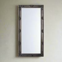 Classic silver leaner mirror with period carved decoration.  A large roccoco framed mirror in silver with a classic ornate look.  A great hall mirror, this size will add a lot of light and pespective to any entryway.   Great in a dressing room, leaning or hanging on a wall. In your living room to add statement glamour to your room.
