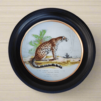 Enhance your decor with this Medium Round Leopard Print Wall Art 38cm. In striking black and gilt frames, it elevates walls with elegance.