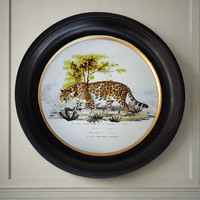 Adorn your space with our 38cm Medium Round Leopard Print Wall Art. Classic black frame this piece impactful, perfect for an elegant walkway.