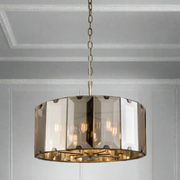 Round smoked glass ceiling pendant, the smoked glass, a dramatic polished pendant perfect over dining table. Giving an atmospheric light wherever it's placed.
W: 50 cm H: 50 - 122 cm