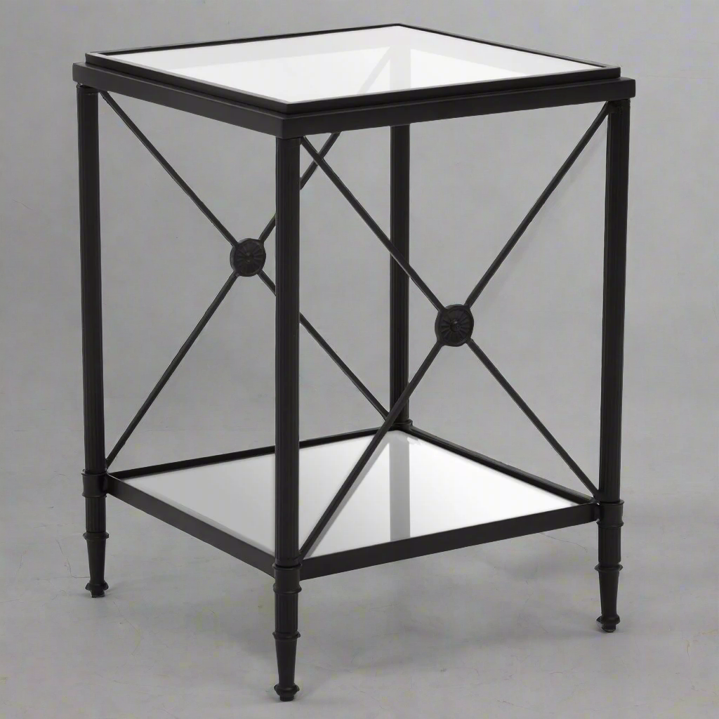 Square, black metal and tempered glass. One of our favourite side tables, we have them in the brass finish but now they come in black, perfect for a contemporary home. A classic metal and glass cross legged side or sofa table.