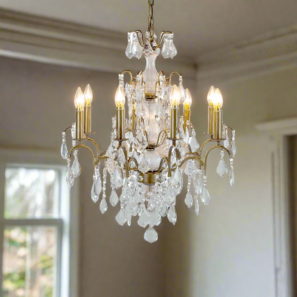 Stunning classic shaped chandelier smothered in crystal drops on a gold metal base. The classic, longer 8 arm chandelier in gold with a mass of crystal drops. A perfect hall or bedroom chandelier for a period home.