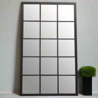 Tall, imposing window mirror with 15 panes set in a black metal frame. As with all window mirrors, wherever they are placed they give the illusion of the room being much larger and lighter than it actually is, this mirror is no exception. Hung vertically or horizontally inside or out, its a showstopper.  Fantastic in a kitchen, stunning in your hall or on a patio in the garden, you'll be thrilled with the look of this mirror.