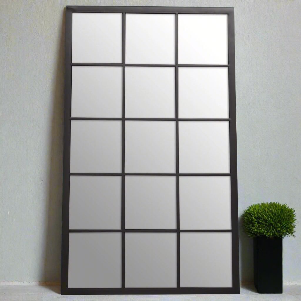 Tall, imposing window mirror with 15 panes set in a black metal frame. As with all window mirrors, wherever they are placed they give the illusion of the room being much larger and lighter than it actually is, this mirror is no exception. Hung vertically or horizontally inside or out, its a showstopper.  Fantastic in a kitchen, stunning in your hall or on a patio in the garden, you'll be thrilled with the look of this mirror.