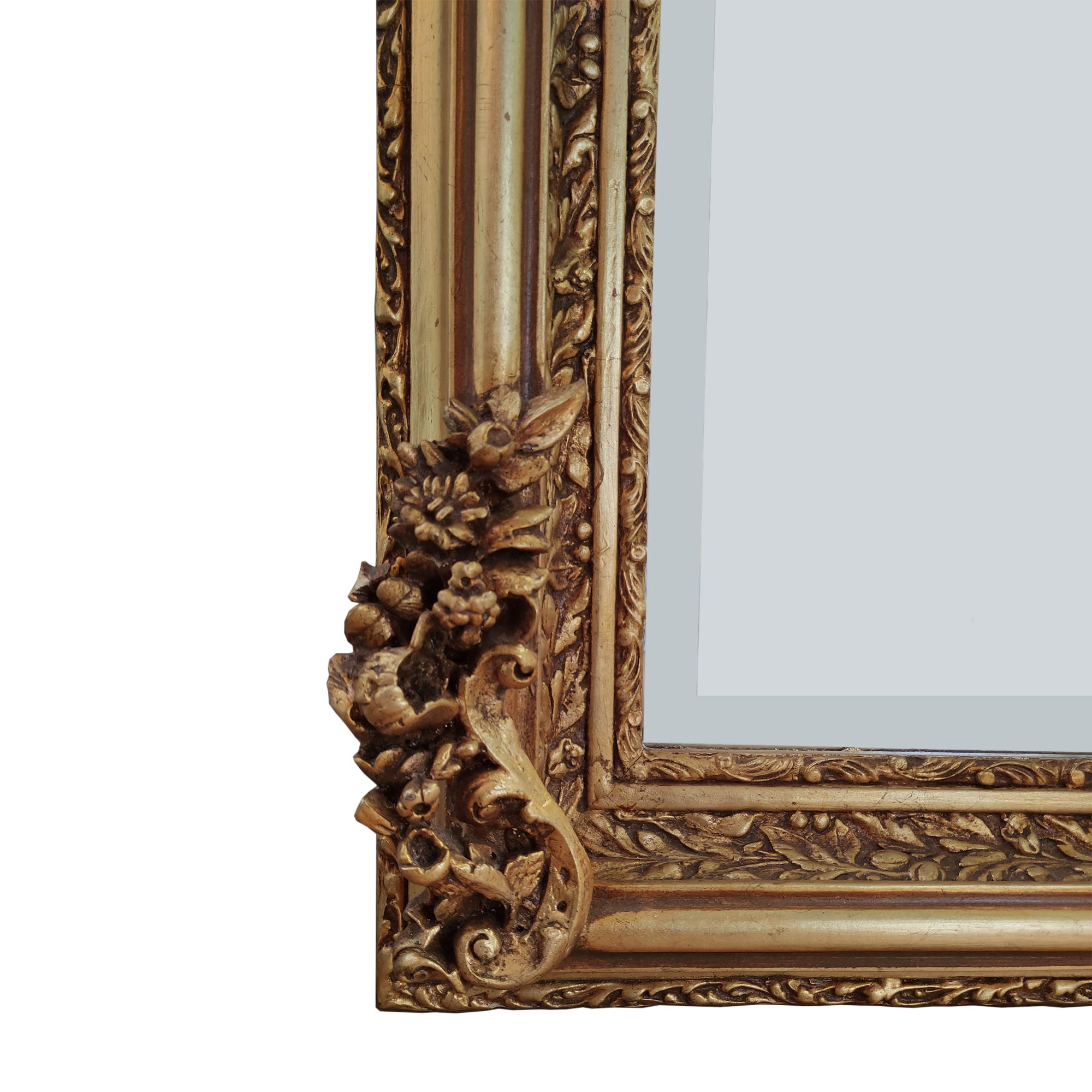 Transform any room into a luxurious retreat with our stunning giltwood mirror. Measuring an impressive 152 cm in height and 86 cm in width, this large ornate gilt mirror  is a masterpiece of Georgian-inspired design, perfect for adding a touch of timeless elegance to your home
The beautifully decorated gilt wood frame showcases intricate details such as musical instruments, swags, and other ornate embellishments. The heavily decorated frame exudes opulence, making it a standout piece in any setti