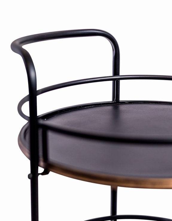 A three tier black industrial drinks trolley, the black metal brushed by gilt to the edges. On castors this trolley will hold all the necessary bottles and glasses.