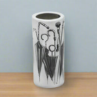 White ceramic umbrella stand.  A useful storage solution for your hall or porch to tidy and store all your umbrellas and sticks. 