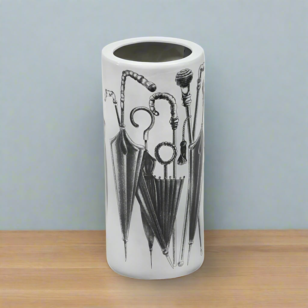 White ceramic umbrella stand.  A useful storage solution for your hall or porch to tidy and store all your umbrellas and sticks. 