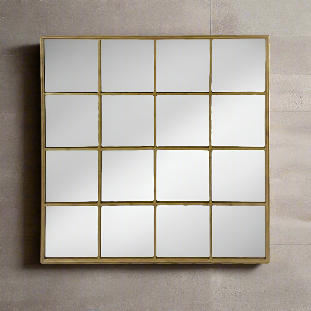 Window mirror consisting of sixteen panes in a antique gold frame. Gold window are so versatile  in that they have the industrial feel of window mirrors bu the glamour of being gold.