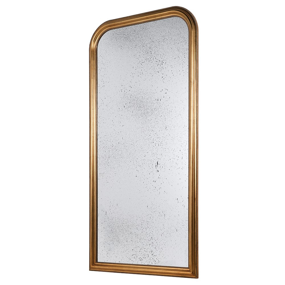 Tall arched mirror with aged glass and a gilt beaded frame, ideal for adding a glamorous touch to home interiors. Measures 183 cm in height.
