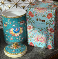 Handcrafted ceramic candle jar with turquoise floral design and gold detailing, scented with Aloe and Sea Salt.