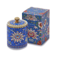 Handcrafted blue ceramic scented candle jar with floral design and gold detailing, scented with Black Cedar.