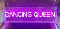 This is a vibrant neon wall sign with the words "dancing queen" written in bright pink neon light, housed in a clear acrylic box. The sign is sleek and modern, with two small holes at the top corners for wall mounting. Perfect for personal spaces like bedrooms, living rooms, or entertainment areas as well as dance studios or bars.
A perfect retro look for girls and women of all ages.
It comes with an USB cable with dimmer switch.