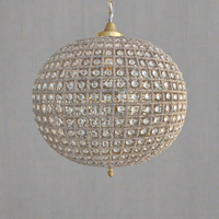 Brass Globe Chandelier with crystal beading encased in brass metalwork that reflects a pretty pattern around your ceiling and walls. A classic and glamorous ceiling light which compliments all types of decor.