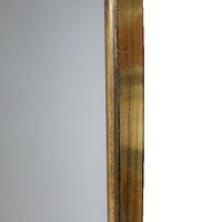 Arched Metal Shaped Gilt Mirror. Pretty rounded shaping to the top of this long mirror adds interest and style.  Perfect in a dressing room, bedroom, or at the end of a long hall to add light and perspective to your space.