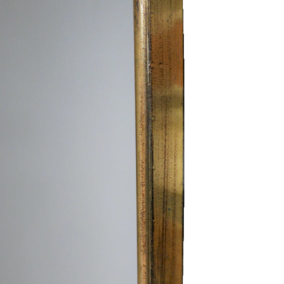 Arched Metal Shaped Gilt Mirror. Pretty rounded shaping to the top of this long mirror adds interest and style.  Perfect in a dressing room, bedroom, or at the end of a long hall to add light and perspective to your space.
