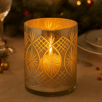 Large mercury glass candleholder for a festive table setting.