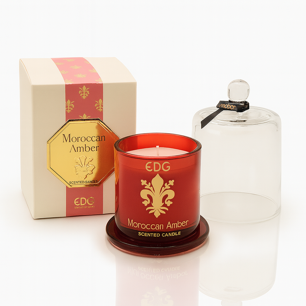 Moroccan Amber luxury scented candle in red glass with gold detailing and a clear cloche, presented in a matching gift box.