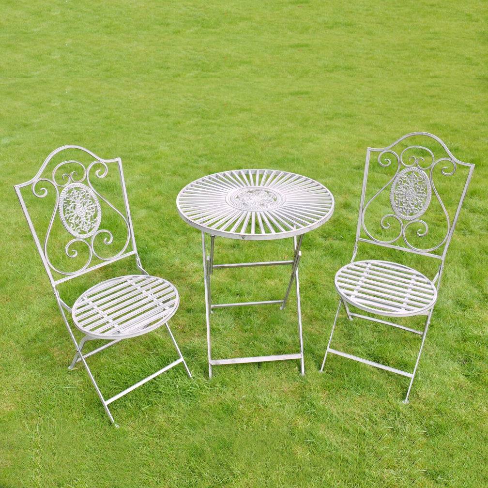 A three piece garden furniture set comprising a round table  and two open lattice work chairs in a distressed grey colour (the close-up images of this set are a better representation of the colour than the main image).  Perfect size for a small garden, patio or even a balcony. The set is constructed in powder coated iron for weather resistance and durability. The three pieces can be folded down for easy storage.