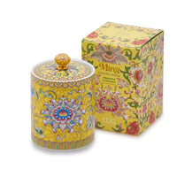 Handcrafted yellow ceramic scented candle jar with gold detailing and floral design, scented with Pineapple and Coconut.