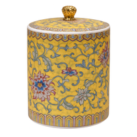 Handcrafted yellow ceramic scented candle jar with gold detailing and floral design, scented with Pineapple and Coconut.